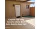 Carport side entry with security-storm door and auto dusk to dawn light at 1308 S Spur --, Mesa, AZ 85204