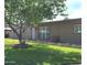 Charming single-story home with lush front yard, tree, and well-maintained landscaping at 1308 S Spur --, Mesa, AZ 85204