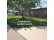 Well-maintained front yard with lush green lawn and automated sprinkler system at 1308 S Spur --, Mesa, AZ 85204