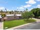 Charming home with a lush front yard and a well-maintained lawn at 1308 S Spur --, Mesa, AZ 85204
