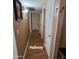 Hallway with wood-look floors and neutral colored walls at 1308 S Spur --, Mesa, AZ 85204