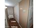 Hallway featuring a linen closet and Primary bathroom entrance at 1308 S Spur --, Mesa, AZ 85204