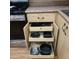 The kitchen contains pullout drawers inside kitchen cabinets for pots and pans at 1308 S Spur --, Mesa, AZ 85204