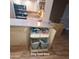 Kitchen island with pull-out drawers and built-in dog food storage bins at 1308 S Spur --, Mesa, AZ 85204