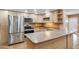 Well-lit kitchen with stainless steel appliances, granite countertops, and ample cabinet space for a modern look at 1308 S Spur --, Mesa, AZ 85204