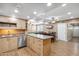 Large kitchen area has natural cabinets, granite countertops, modern appliances, dining area and pool table at 1308 S Spur --, Mesa, AZ 85204