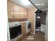 Functional laundry room with modern washer and dryer, complemented by cabinets and drawer pedestals at 1308 S Spur --, Mesa, AZ 85204
