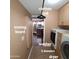 Inviting laundry room with modern washer, dryer, and kitchen view, complete with functional ironing board at 1308 S Spur --, Mesa, AZ 85204