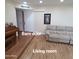 Living room with wood look floors, barn door in background at 1308 S Spur --, Mesa, AZ 85204