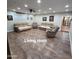 Open-concept living room with wood-look flooring and neutral color scheme, plenty of space at 1308 S Spur --, Mesa, AZ 85204