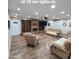Spacious living room features recessed lighting, a brick fireplace, and built-in shelving at 1308 S Spur --, Mesa, AZ 85204
