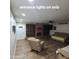 Open-concept living room with wood-look flooring and neutral color scheme, fireplace in background at 1308 S Spur --, Mesa, AZ 85204