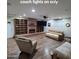 Spacious living room features recessed lighting, a brick fireplace, and built-in shelving at 1308 S Spur --, Mesa, AZ 85204