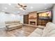 This living room has a fireplace, built-in shelves, wood-look floors and natural light at 1308 S Spur --, Mesa, AZ 85204