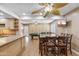 A generous living space adjacent to kitchen and dining area featuring natural lighting, pool table, and entertainment space at 1308 S Spur --, Mesa, AZ 85204