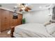 Spacious main bedroom with ceiling fan, closet, and built in entertainment storage at 1308 S Spur --, Mesa, AZ 85204
