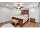 Main bedroom with ceiling fan, hardwood floors, sconces, and bedside table at 1308 S Spur --, Mesa, AZ 85204