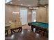 Pantry and backyard access from this multi-purpose room with a pool table and dining area at 1308 S Spur --, Mesa, AZ 85204