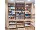 East pantry wall showing adjustable shelving and roll out bottom shelves at 1308 S Spur --, Mesa, AZ 85204