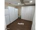 A walk in pantry with three large refrigerators and storage cabinets at 1308 S Spur --, Mesa, AZ 85204