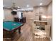 Playroom with pool table, dining area, and puppy Bedroom in the back at 1308 S Spur --, Mesa, AZ 85204
