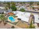 Aerial view of the backyard featuring a custom-shaped pool, boat, and well-maintained landscaping at 1308 S Spur --, Mesa, AZ 85204