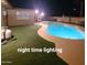Backyard pool illuminated at night at 1308 S Spur --, Mesa, AZ 85204
