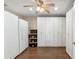 This room features lots of white storage cabinets, wood-look flooring, and plenty of space at 1308 S Spur --, Mesa, AZ 85204