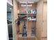 Pantry wall cabinet with cleaning supplies, vacuums, and pet accessories at 1308 S Spur --, Mesa, AZ 85204
