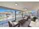 Covered back patio area with lounge seating and a view of the pool at 1444 W Wickieup Ln, Phoenix, AZ 85027