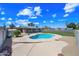 Large backyard featuring a pristine pool and lush, landscaped area at 1444 W Wickieup Ln, Phoenix, AZ 85027
