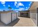The backyard features a storage shed, fence, and covered carport area, enhancing the property's outdoor functionality at 1444 W Wickieup Ln, Phoenix, AZ 85027