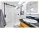 Modern bathroom features a tiled walk-in shower, vanity and an illuminated mirror at 1444 W Wickieup Ln, Phoenix, AZ 85027