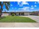 Charming single-story home featuring a well-manicured lawn and neutral tones at 1444 W Wickieup Ln, Phoenix, AZ 85027
