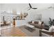 Open-concept living room with modern decor, light hardwood floors, and a ceiling fan at 1444 W Wickieup Ln, Phoenix, AZ 85027