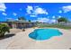 Inviting pool with rock features and a backdrop of tropical greenery at 1444 W Wickieup Ln, Phoenix, AZ 85027