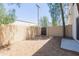 Backyard area with gravel, block wall and a gate at 15818 N 25Th St # 124, Phoenix, AZ 85032