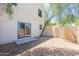 A peaceful backyard featuring gravel landscaping and a mature tree at 15818 N 25Th St # 124, Phoenix, AZ 85032