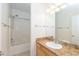 Bathroom with granite vanity, tub with shower, and tiled flooring at 15818 N 25Th St # 124, Phoenix, AZ 85032