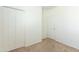 Neutral bedroom with carpet and double door closets at 15818 N 25Th St # 124, Phoenix, AZ 85032