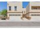 Inviting two-story home boasts a neutral stucco finish and a convenient two-car garage at 15818 N 25Th St # 124, Phoenix, AZ 85032