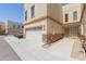 Charming townhome featuring a two-car garage, stone accents, and a well-maintained facade at 15818 N 25Th St # 124, Phoenix, AZ 85032