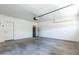 Spacious two-car garage with white walls and gray flooring at 15818 N 25Th St # 124, Phoenix, AZ 85032