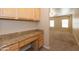 Functional home office space featuring built-in desk and granite countertops at 15818 N 25Th St # 124, Phoenix, AZ 85032