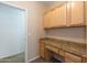 Functional home office space featuring built-in desk and granite countertops at 15818 N 25Th St # 124, Phoenix, AZ 85032