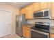Modern kitchen with stainless steel appliances and attractive granite countertops at 15818 N 25Th St # 124, Phoenix, AZ 85032