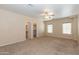 Large main bedroom with cozy carpet, a ceiling fan, and abundant natural light at 15818 N 25Th St # 124, Phoenix, AZ 85032