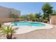 Community pool featuring comfortable lounge chairs and mature landscaping for an enjoyable experience at 15818 N 25Th St # 124, Phoenix, AZ 85032