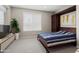 Bedroom with bed, window, potted plant, and built-in storage at 16953 W Merrell St, Goodyear, AZ 85395