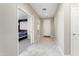 Welcoming foyer with tile flooring and a view into the adjacent bedroom at 16953 W Merrell St, Goodyear, AZ 85395